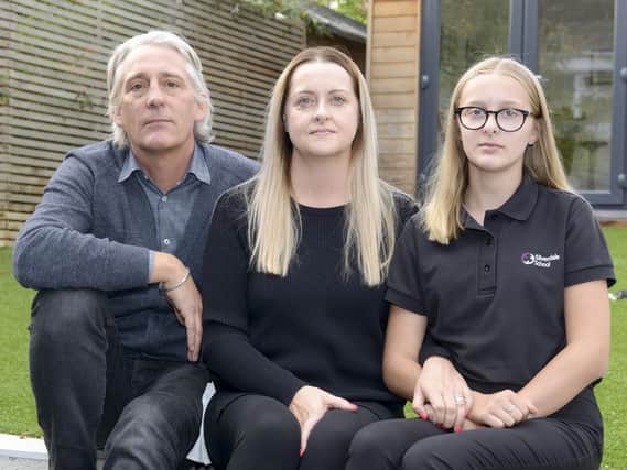 Joanne, Polly and Simon Holland have won an apology from Manchester Airport after being 'treated like terrorists' by security staff.