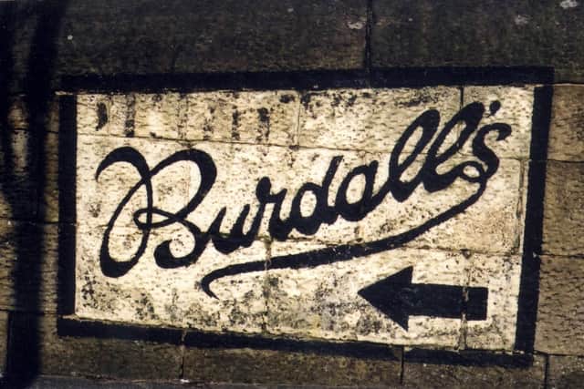 A  sign to the Burdall's factory preserved on a wall at Hillsborough Barracks