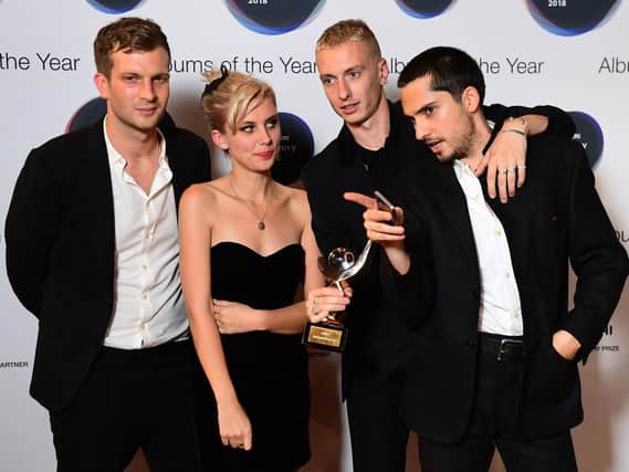 Joff Oddie, Ellie Rowsell, Theo Ellis and Joel Amey of Wolf Alice celebrate winning the 2018 Hyundai Mercury Music Prize, held at the Eventim Apollo, London.  Ian West/PA Wire
