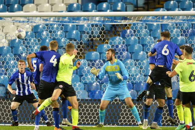 Martin Cranie heads in United's third goal