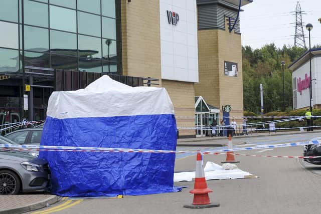 Police at the scene of the stabbing at Centertainmement in Sheffield