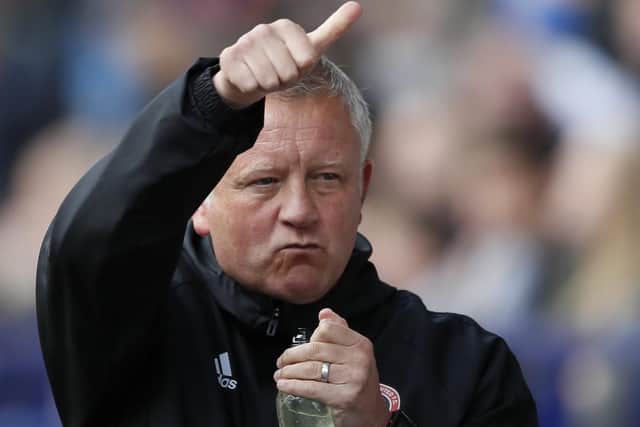 Sheffield United manager Chris Wilder protects his players