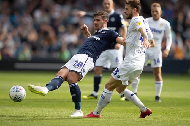 Leeds United's Mateusz Klich (right) and Millwall's Ryan Leonard during the Sky Bet Championship match at The New Den, London.