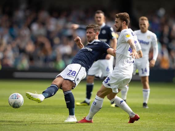 Leeds United's Mateusz Klich (right) and Millwall's Ryan Leonard during the Sky Bet Championship match at The New Den, London.