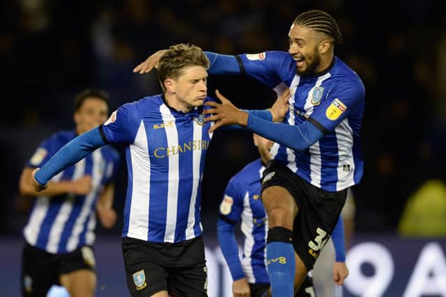 Adam Reach's celebrates his goal for Sheffield Wednesday against Leeds United with Michael Hector......Pic Steve Ellis