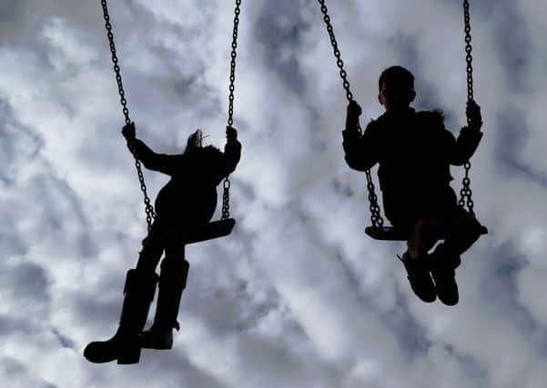 Embargoed to 0001 Tuesday September 18 File photo dated 4/3/2017 of Children playing on swings. Children are most exposed to dangerous air pollution on the school run and while they are out in the playground, experts have warned.