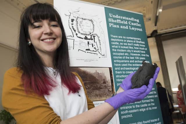 Leigh-Anne Baldrige, of Sheffield Museums, with a shoe found during a dig