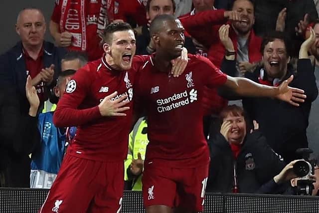 Liverpool's Daniel Sturridge (right) celebrates scoring his side's first goal of the game with Andrew Robertson during the UEFA Champions League, Group C match at Anfield