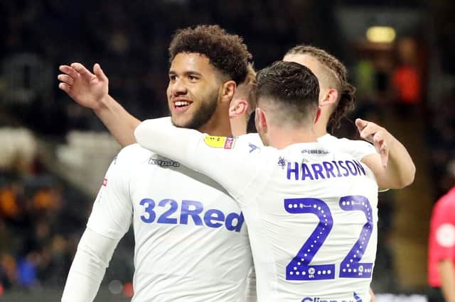 Leeds United's Tyler Roberts (left) celebrates scoring his sides first goal with team mates during the Sky Bet Championship match at the KC Stadium, Hull. Danny Lawson/PA Wire