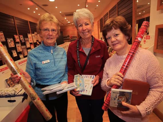 Charity Christmas pop up shop on Chapel Walk in Sheffield. Pictured are Joyce Cooper, Jenny Freeman and Philomena Mason.