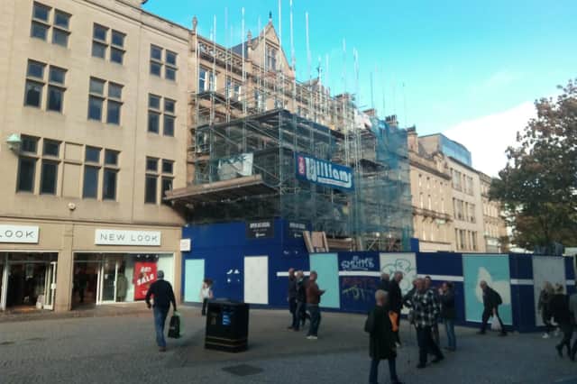 Scaffolding is coming down outside WH Smith on Fargate, Sheffield.