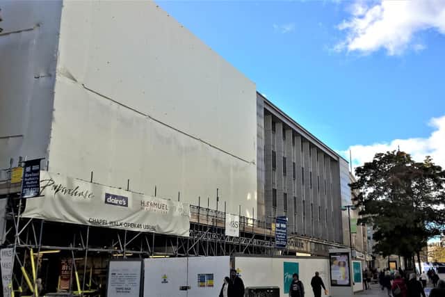 Scaffolding and tarpaulin is still in place over the entrance to Chapel Walk in Sheffield, where offices are to become student flats.