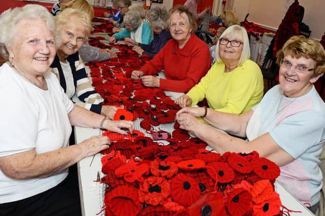Jean Pattinson, Joye Wood, Jean Standage, Laura Rodgers and June Dickens, all church members, pictured adding the Handmade poppies to the cascade.