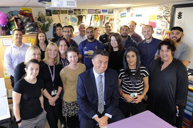 Headteacher Andy Ireland, centre, surrounded by some of his staff. Picture Steve Ellis