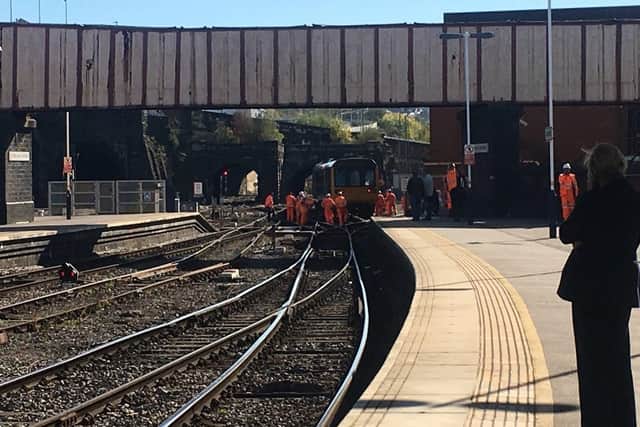 Engineers working to move the derailed train yesterday