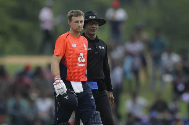 England's Joe Root walks back to pavilion after umpires stopped the play due to bad weather during the first one-day international cricket match between England and Sri Lanka in Dambulla, Sri Lanka, Wednesday, Oct. 10, 2018. (AP Photo/Eranga Jayawardena)