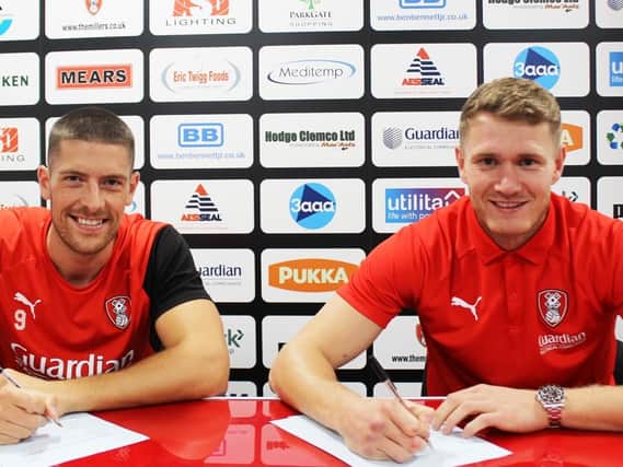 Rotherham have tied strikers Michael Smith and Jamie Proctor down to new long-term contracts