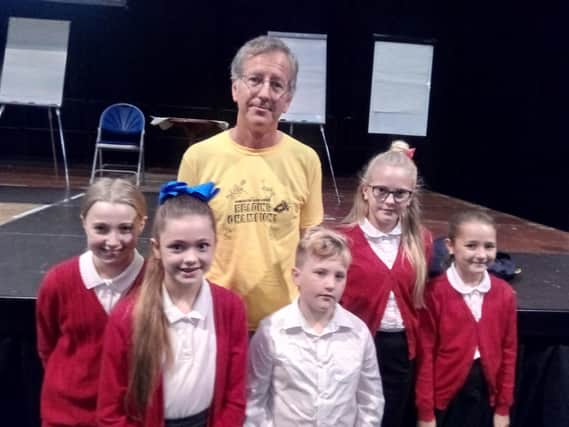 Horrible Histories illustrator Martin Brown with pupils from Adwick Primary School,  at the Doncaster Book Awards launch, 2018-19, at the Dome
