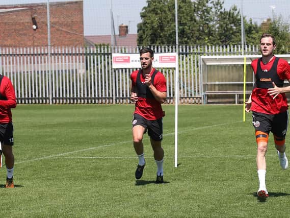 Jake Wright (centre) has returned to training