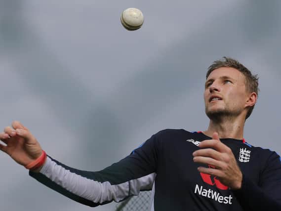 England's Joe Root tosses a ball during a practice session ahead of their second one-day international cricket match with Sri Lanka in Dambulla, Sri Lanka,