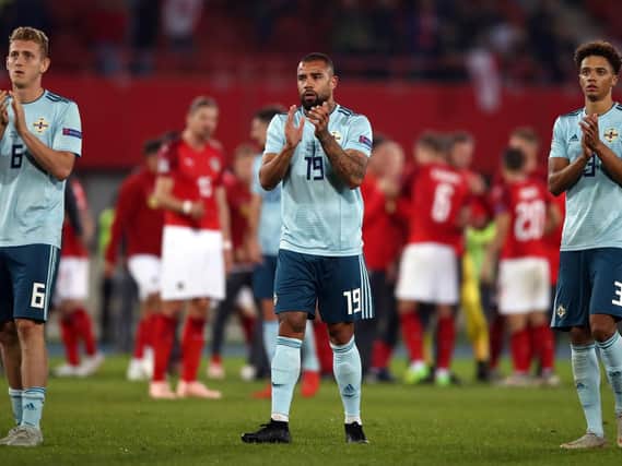Northern Ireland's (from left to right) George Saville, Kyle Vassell and Jamal Lewis applaud the fans after the UEFA Nations League match at the Ernst Happel Stadium, Vienna