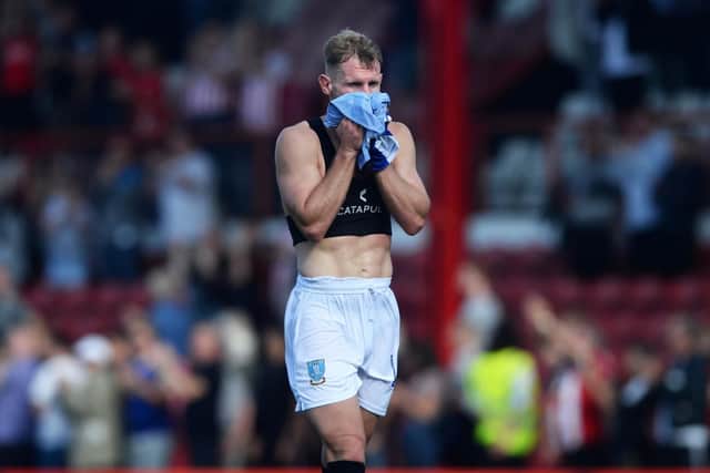 Sheffield Wednesday captain Tom Lees cut a dejected figure after the Owls' loss at Brentford