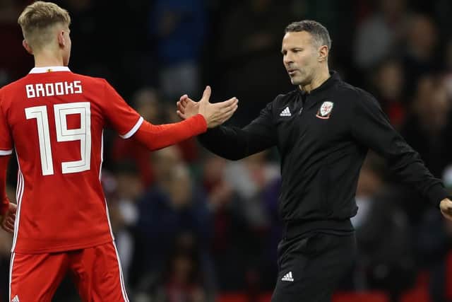 Wales' David Brooks shakes hands with Wales head coach Ryan Giggs after the final whistle during the International Friendly match at the Principality Stadium, Cardiff
