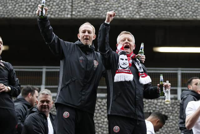 Alan Knill and Chris Wilder on the open-top bus after the League One title success