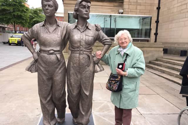 Betty with the Women of Steel statue in Barker's Pool.
