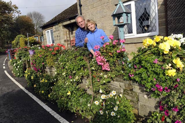 Sally and Brian Williams outside their cottage on Hollin House Lane, Loxley Valley.