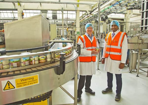 Cooking on gas: Factory General Manager Steve Pretty (left) and Fulcrums Yohan de Silva (right) on the production line at Ambrosia Creamery