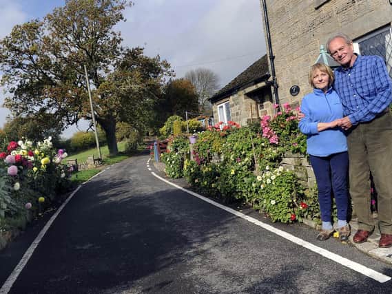 Pictured are Sally and Brian Williams outside their cottage on Hollin House Lane, Loxley Valley, who are in dispute with Sheffield City Council over their flower beds