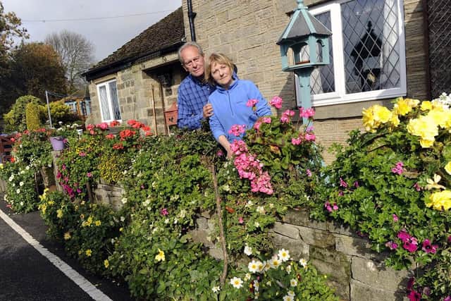 Pictured are Sally and Brian Williams outside their cottage on Hollin House Lane, Loxley Valley, who are in dispute with Sheffield City Council over their flower beds