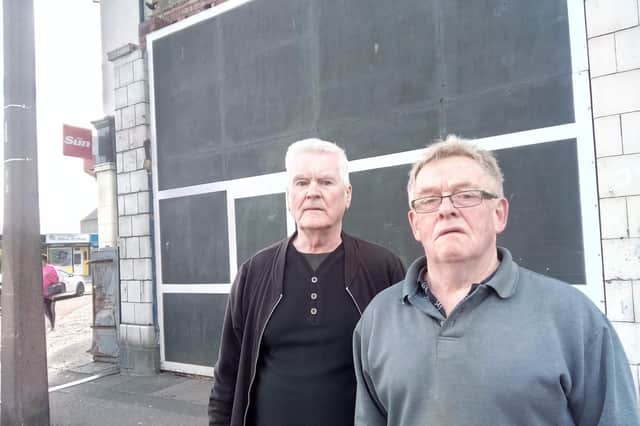Frank Arrowsmith and Jim Mourning in front of the burned out shop on Main Avenue, Edlington
