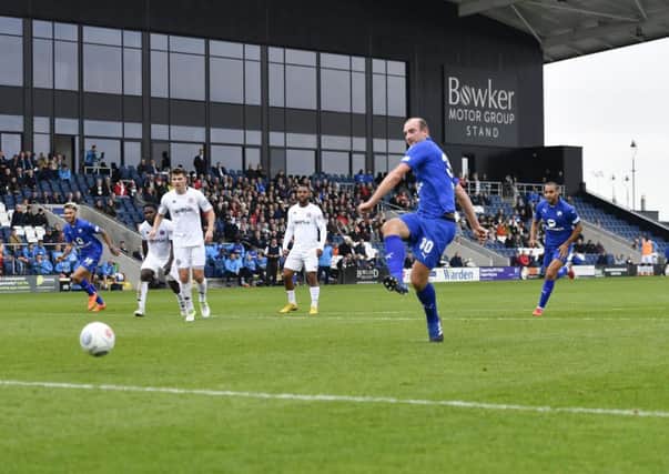 Chesterfield's Tom Denton scores from the penalty spot: Picture by Steve Flynn/AHPIX.com, Football: The Emirates FA Cup - Qualifing Fourth Round match AFC Fylde -V- Chesterfield at Mill Farm, Wesham, Lancashire, England on copyright picture Howard Roe 07973 739229
