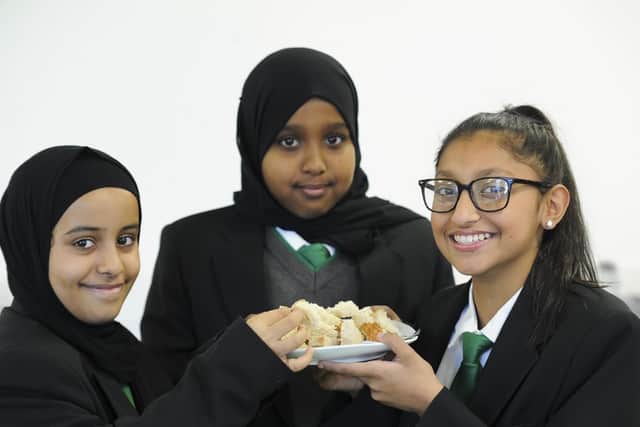 Year seven pupils Amall Nasser, Ifraah Mohamed, Khadijah Hussain try some bread in a technology class