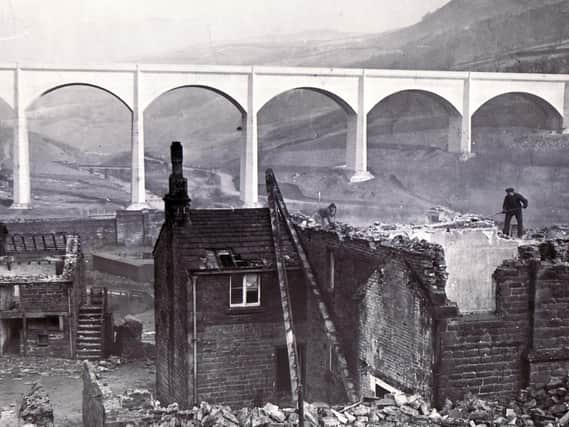 Ladybower Reservoir viaduct towering over the village of Ashopton as it was being demolished