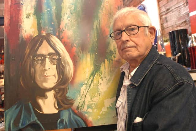 Colin Duffield, aged 84, with his portrait of John Lennon