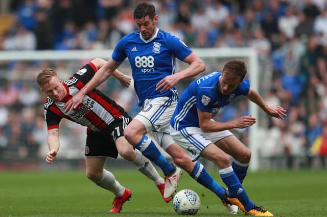 Lukas Jutkiewicz (centre) powers his way through against Sheffield United's Mark Duffy earlier this year