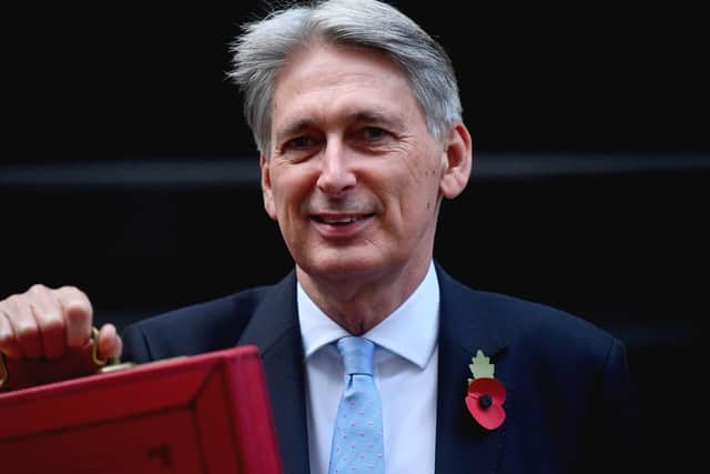 Chancellor Philip Hammond holding his red ministerial box outside 11 Downing Street, London, before heading to the House of Commons to deliver his Budget. Picture: Victoria Jones/PA Wire.