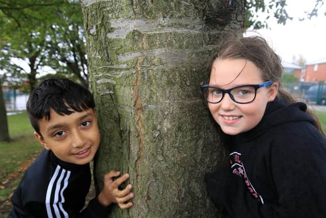 Sahhel Aryan, 10, and Jasmine Bower, nine, take part in Forest School activities
