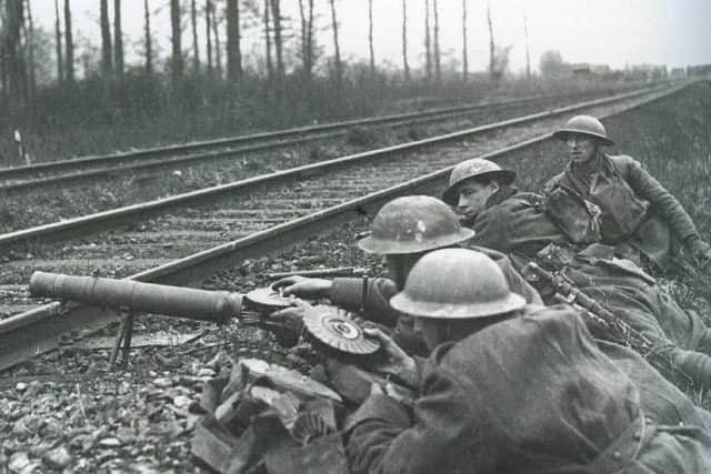 Troops belonging to the 13th Battalion York and Lancaster Regiment take up positions to meet advancing Germans during the spring offensive of 1918