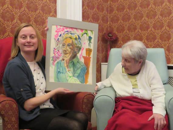 Artist Joyce Spur (right) and Clara Morgan with the painting of Enid Hattersley