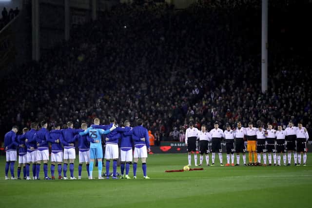 The two team's stand during a minute's silence for Remembrance Sunday before the Sky Bet Championship match at Bramall Lane, Sheffield. PRESS ASSOCIATION