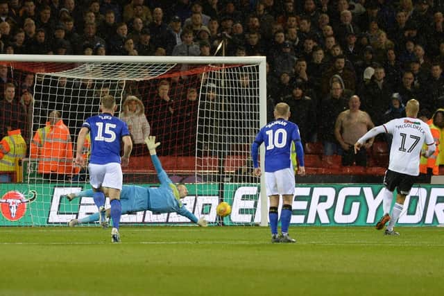 Cameron Dawson keeps out David McGoldrick's penalty. Picture: Steve Ellis