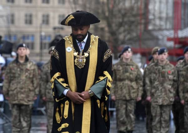 Lord Mayor of Sheffield, Councillor Magid Magid, wearing a white poppy at the remembrance parade at Barkers Pool, Sheffield on Sunday, November 11, 2018.