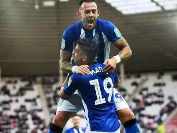 Sheffield Wednesday striker Steven Fletcher has been called up to the Scotland squad for the first time in 13 months.