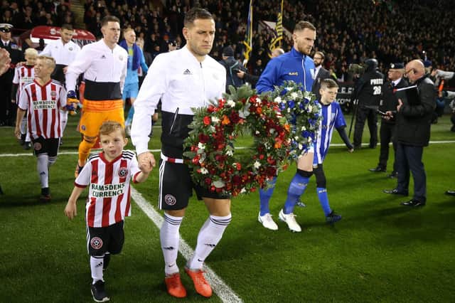 Billy Sharp of Sheffield Utd and Tom Lees of Sheffield Wednesday carry out wreaths ahead of the Steel City Derby: Simon Bellis/Sportimage