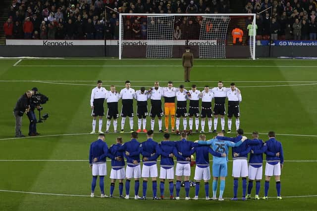 Players from both Sheffield United and Sheffield Wednesday line up for a minute's silence: James Wilson/Sportimage