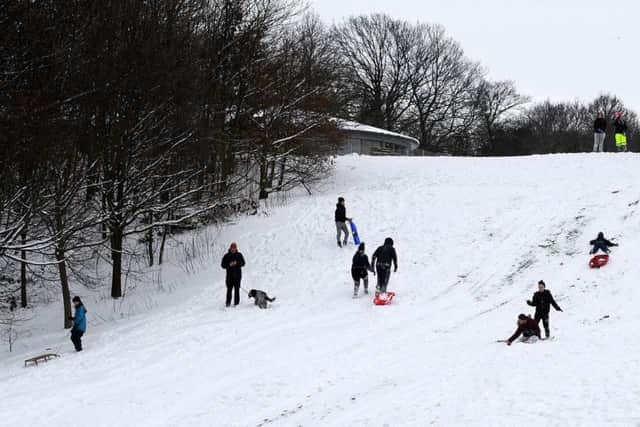 People enjoying the snow in Norfolk Heritage Park, Sheffield, after a wintry blast swept over the UK in March, 2018.